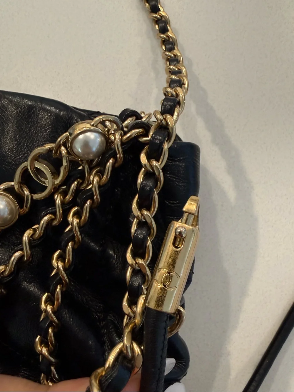 CHANEL 22 Black Quilted Leather Crossbody with Pearl-Trim Chain